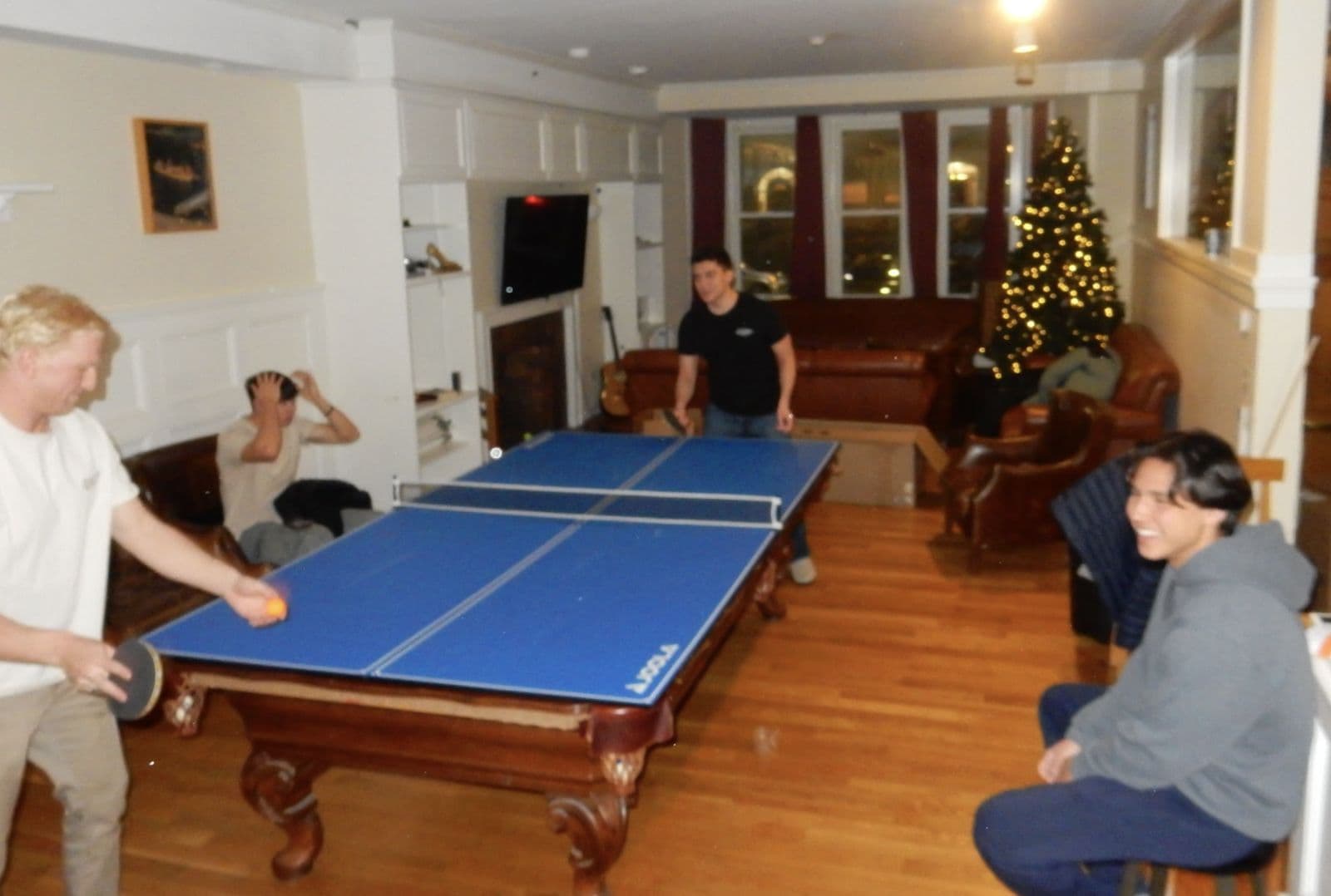 A ping-pong rally in Second Commons beside the Christmas tree.
